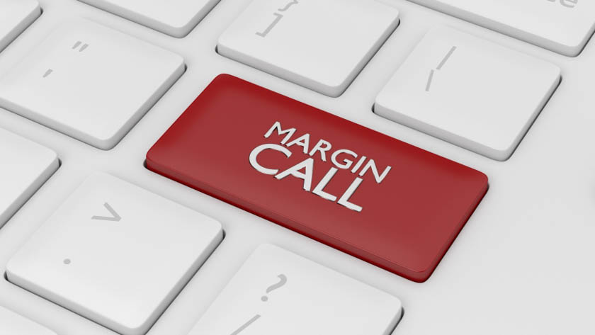 Toetsenbord waarop één knop rood gekleurd is en de tekst 'MARGIN CALL' bevat.